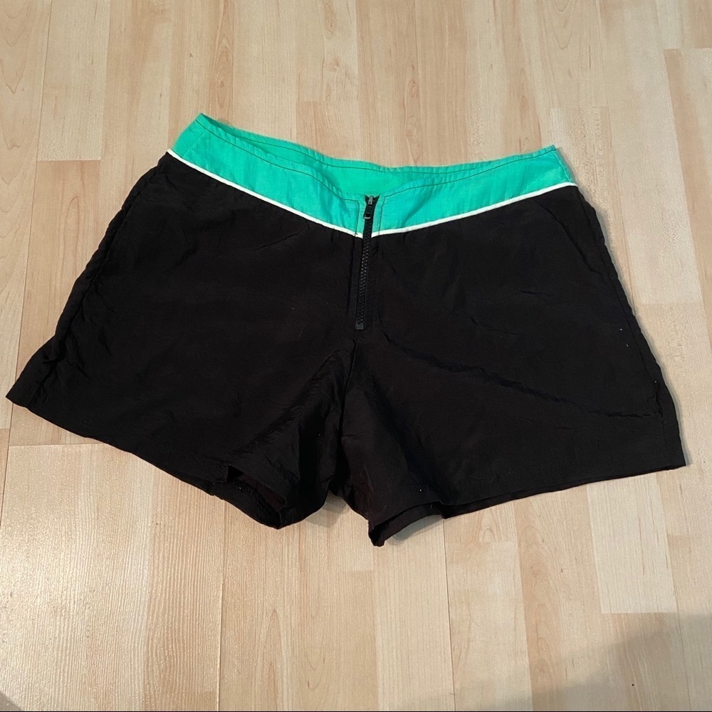 Vintage women’s black and green nylon shorts in size small